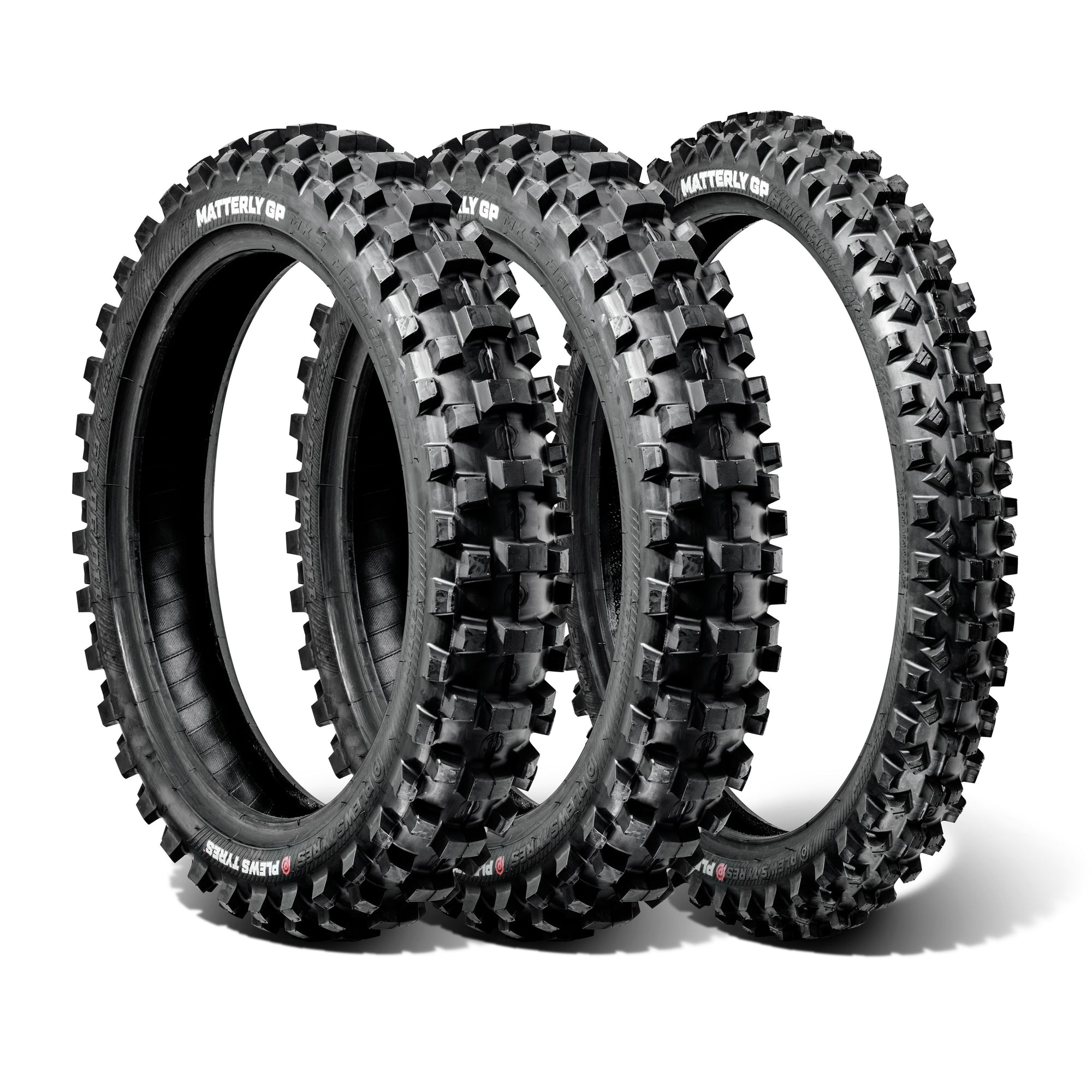 Three off-road dirt bike tires with knobby treads on a white background